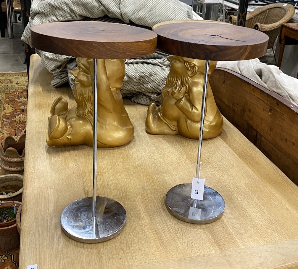 A pair of contemporary hardwood topped steel stands